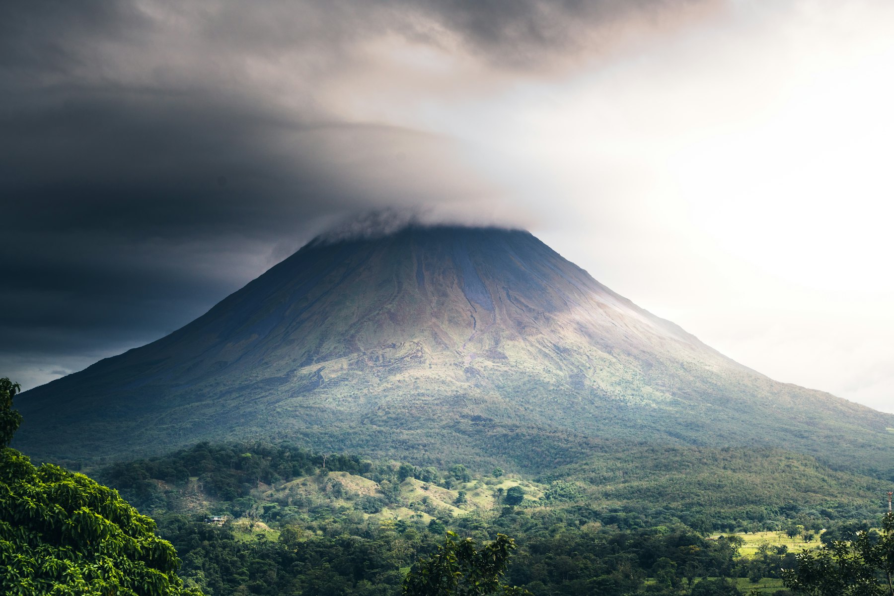 Arenal volcano rising above the Costa Rican landscape
