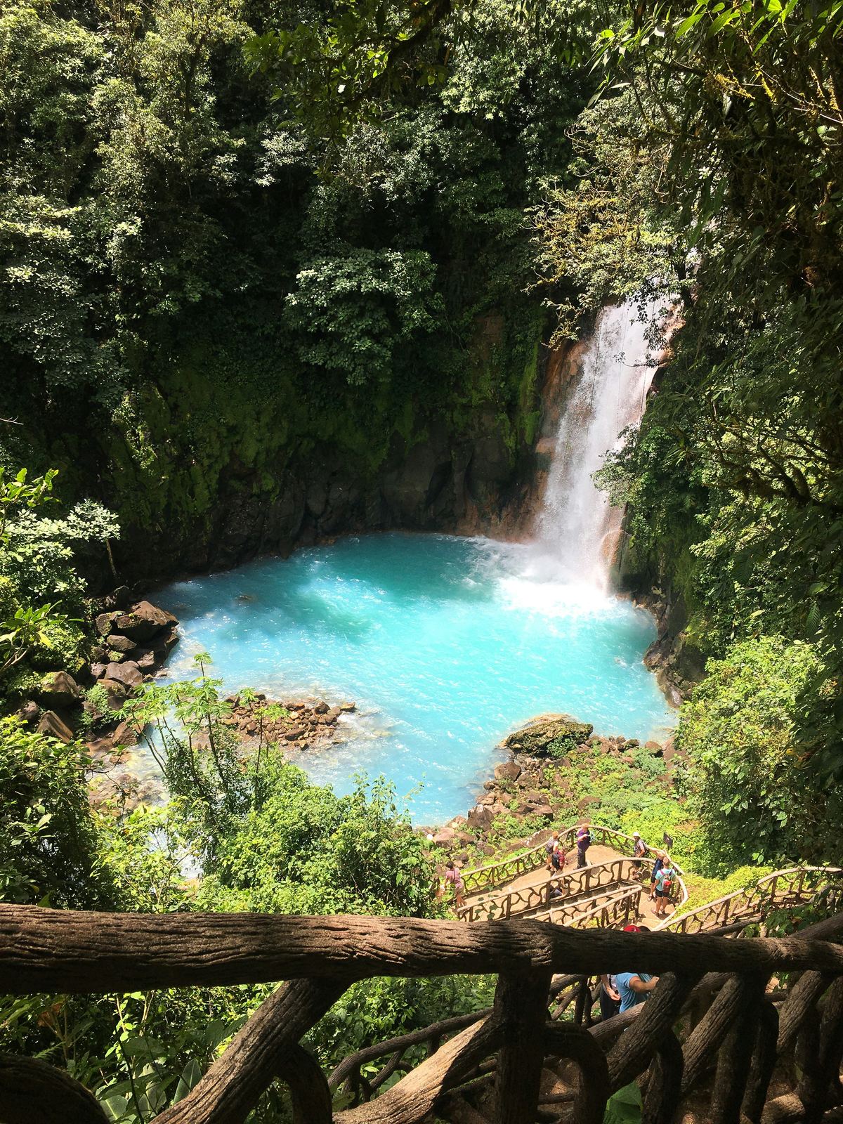 Turquoise waterfall pool in the Costa Rican rainforest